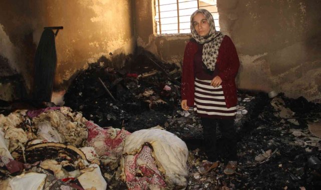 Evini ateşe veren adamı komşuları kurtardı