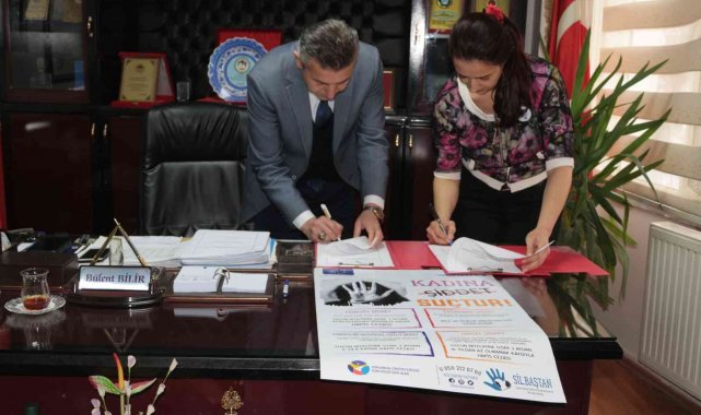 Kadına şiddete afişli uyarı