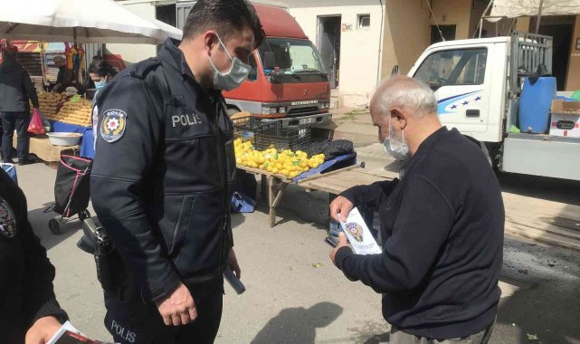 Polisten pazar yerinde dolandırıcılara karşı uyarı