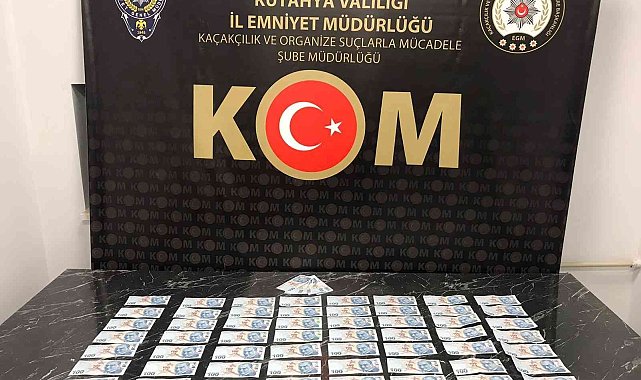 Kütahya'da piyasaya sahte para süren iki kişi yakalandı