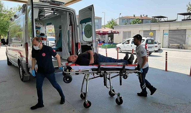 Makineye sıkışan işçi yaralandı