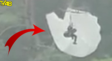 Fethiye Ölüdeniz'de ilginç anlar! Paraşütle atlayan turist ağaçta mahsur kaldı