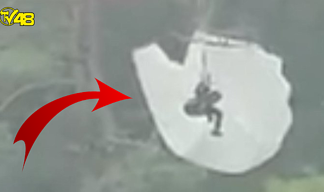 Fethiye Ölüdeniz&#039;de ilginç anlar! Paraşütle atlayan turist ağaçta mahsur kaldı