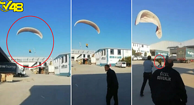 İşe geç kalmamak için fabrika bahçesine paraşütle indi! O anlar kamerada...