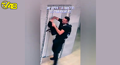 Sahibinin dikkatsizliği nedeniyle asansör kapısından dışarı çıkan köpek, bir polis tarafından son anda kurtarıldı.