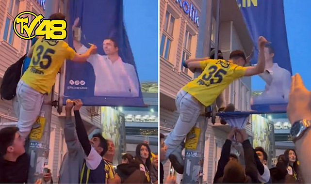 FENERBAHÇELİ TARAFTAR ALİ KOÇ&#039;UN PANKARTINI BIÇAKLADI