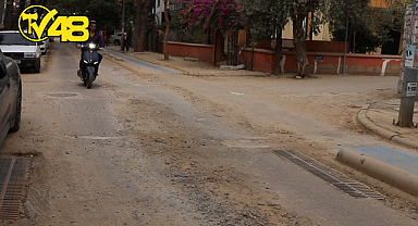 MİLAS'TA YOL ÇİLESİ BİTMİYOR! VATANDAŞ TOZ VE ÇUKURLARIN MAĞDURU